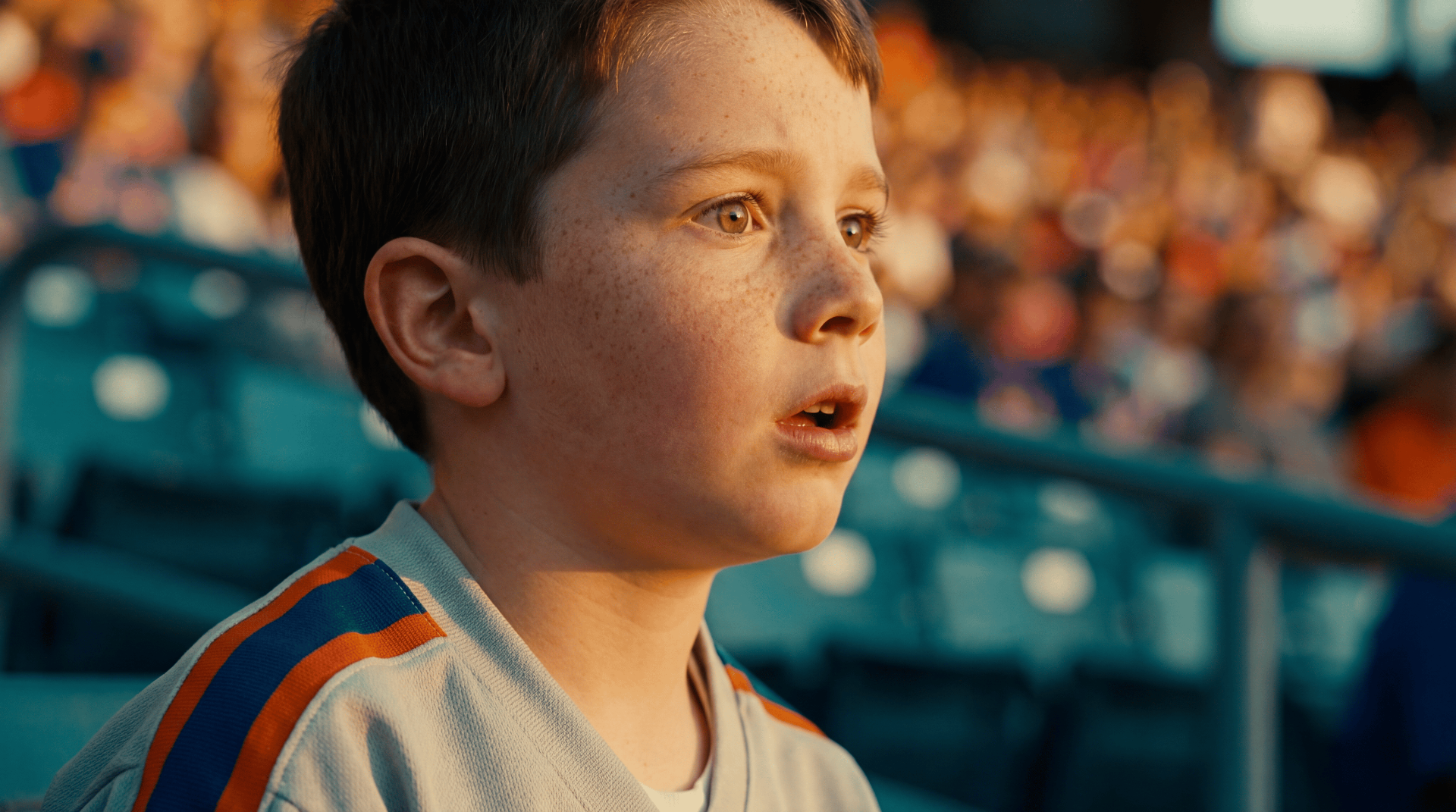 Boy in the stands, awe on his face